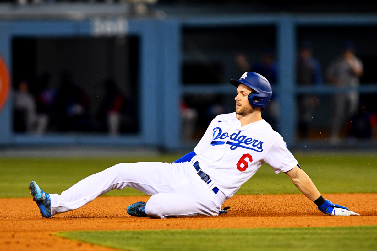 Dodgers shortstop Trea Turner slides into second base.